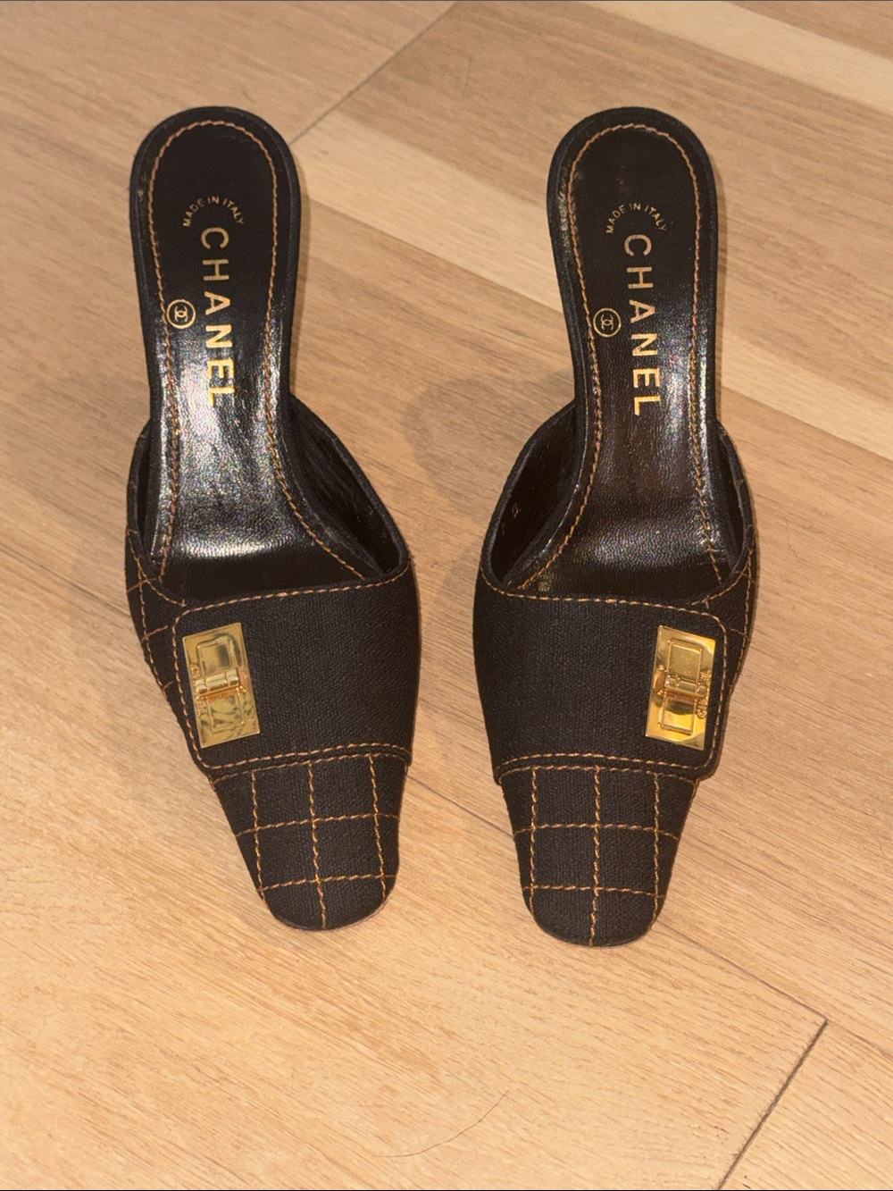 CHANEL Black Quilted Mules with Gold-Tone Accents